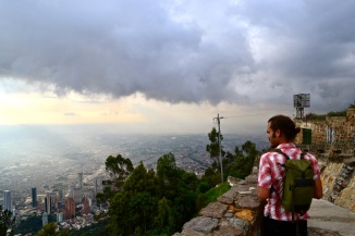 A fellow traveler gazing out over the city in Bogota, Colombia